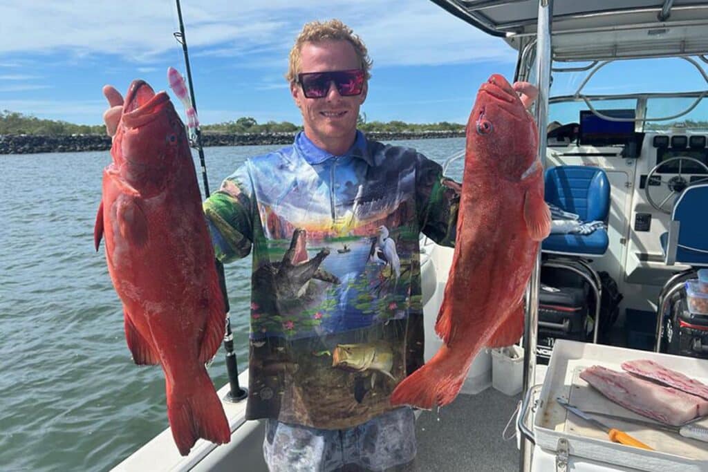 Dylan with a pair of great quality trout caught on a Nomad Squidtrex