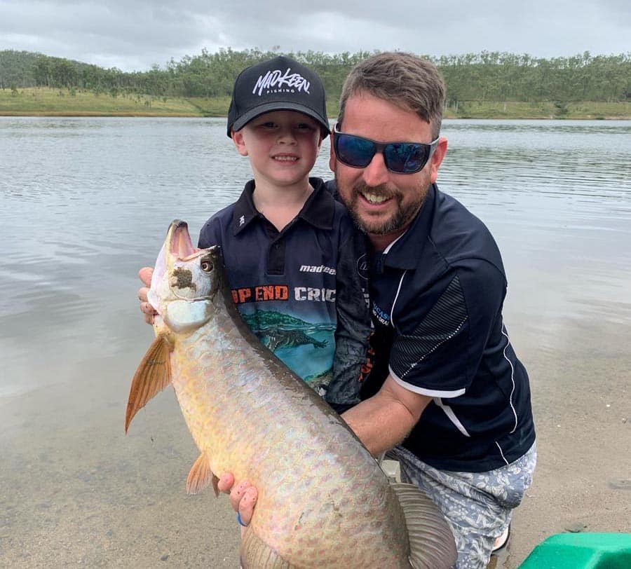 Lewis Kerin and his dad Luke with a massive saratoga.