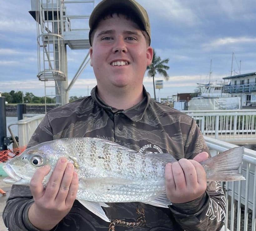 Blair Paul with a solid grunter caught landbased at Burnett Heads