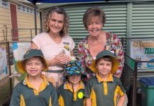 Cr Tracey McPhee and Cr Deb Keslake with students from Gin Gin State School at the Gin Gin Family Frolics U8's Day event.