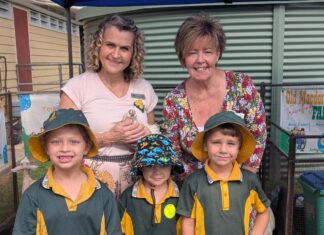 Cr Tracey McPhee and Cr Deb Keslake with students from Gin Gin State School at the Gin Gin Family Frolics U8's Day event.