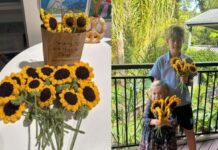 Skye and her brother Tyler with the crocheted sunflowers donated by the Gin Gin Craft 'n Chat group.
