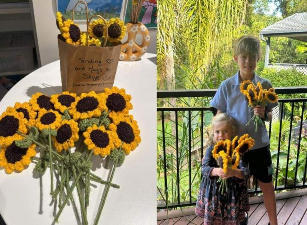 Skye and her brother Tyler with the crocheted sunflowers donated by the Gin Gin Craft 'n Chat group.