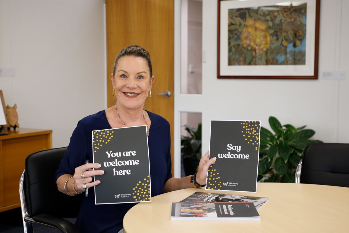 Mayor Helen Blackburn signs the Welcoming Cities Commitment